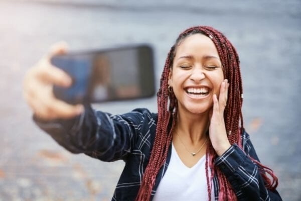 things to be grateful for in yourself, woman taking a photo